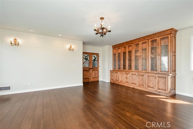 Another perspective on the living room showing more of the new lighting and the new custom cabinets