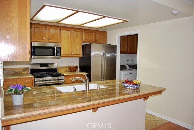 Kitchen with pocket door leading to separate laundry room and pantry