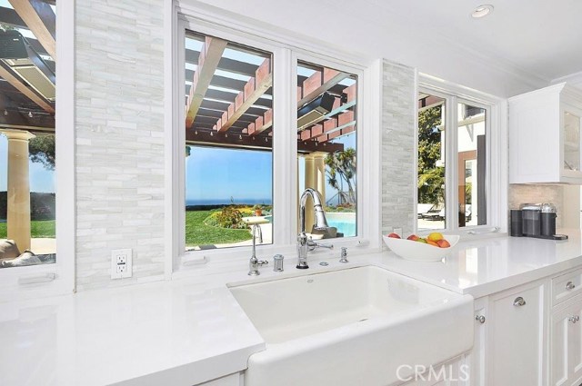 Kitchen with Apron Sink and French Windows with Bar Counters