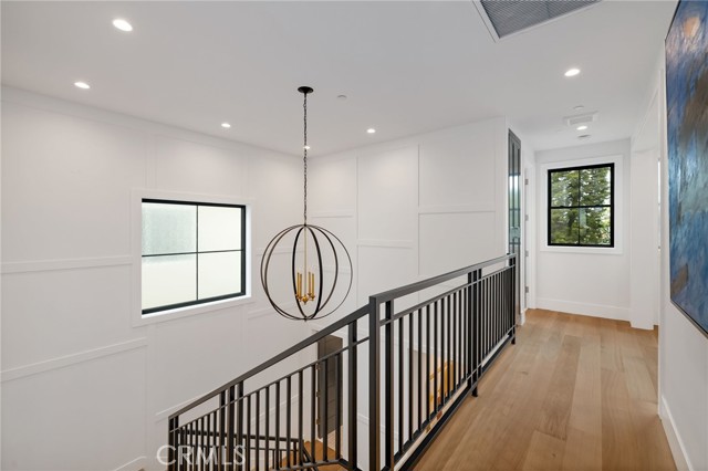 Second floor hallway leads to 4 spacious bedrooms and a bonus room
