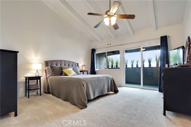 Master Suite with high ceiling with deck off doubled paned sliding glass door