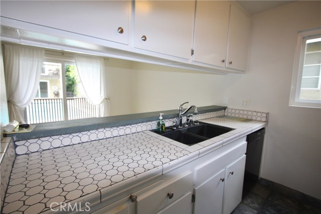 Looking from the kitchen out of the dining area sliding glass door. The pool is just outside,.