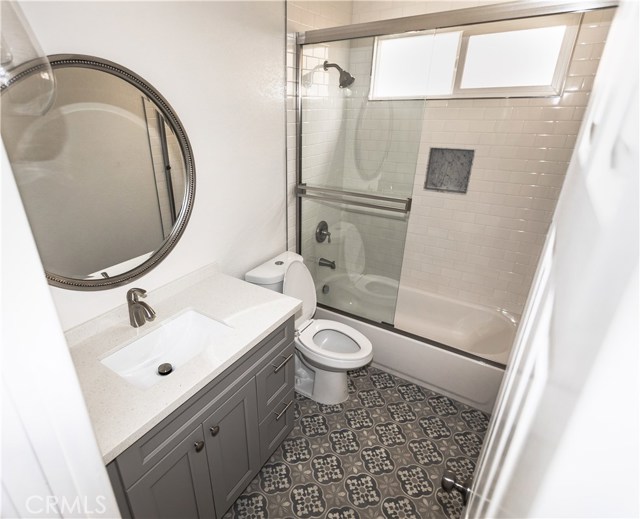 All New Hallway Bath. New tub, tile. vanity and flooring.