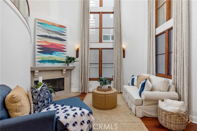 Beautiful front living room with soaring two story window.