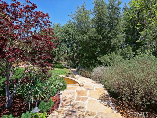 Lovely gardens and grounds along with this fine home enjoy outstanding privacy.  There are automatic
lighting effects that on automatic timers.