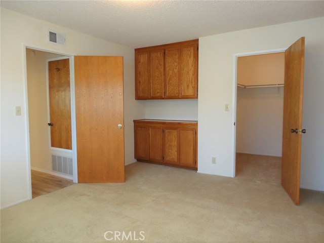 Upstairs master with walk-in closet and built-in cabinets