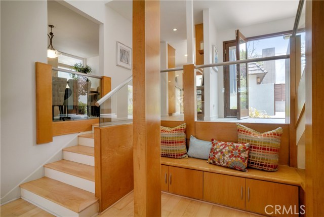 View from landing at living room towards dining room, kitchen and front door.