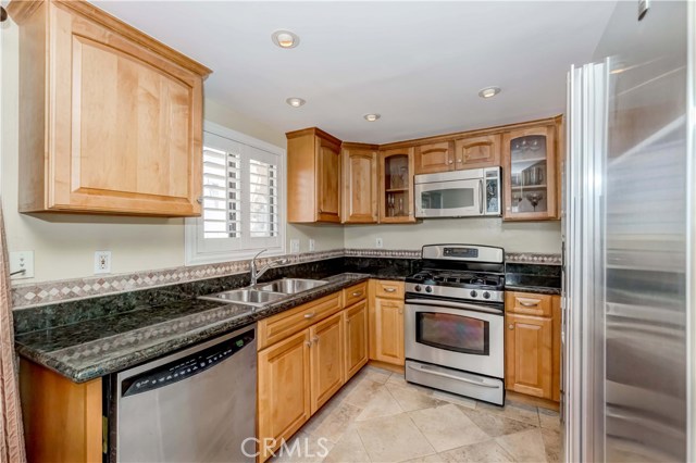 Stainless appliances, granite counters, travertine floors, LED lighting