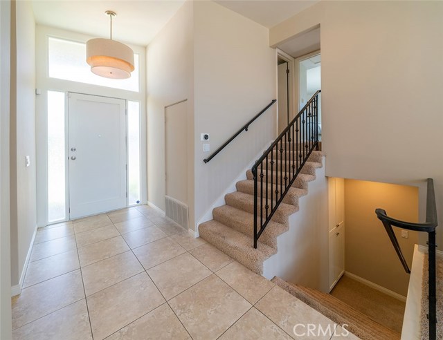 Stairways leading down to master suite or up to additional 3 bedrooms