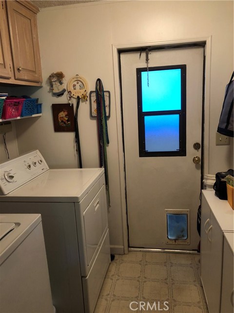 Laundry room with storage.