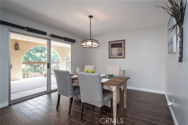 Dining Room has Glass Doors Leading to Balcony with Pool View Dining Room has Glass Doors Leading to Balcony with Pool View