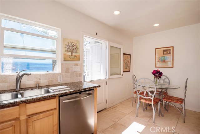 Kitchen with Dining nook and door to backyard and patio