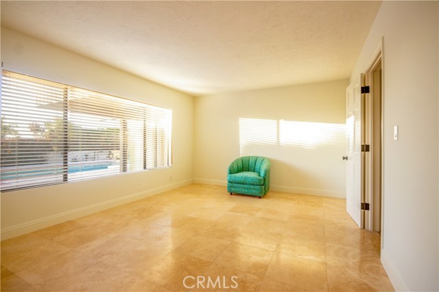 Lower level bedroom with a lot of light facing the pool adjacent to Jack n Jill bath