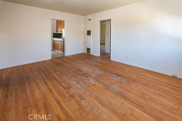 Living room facing kitchen and bedrooms