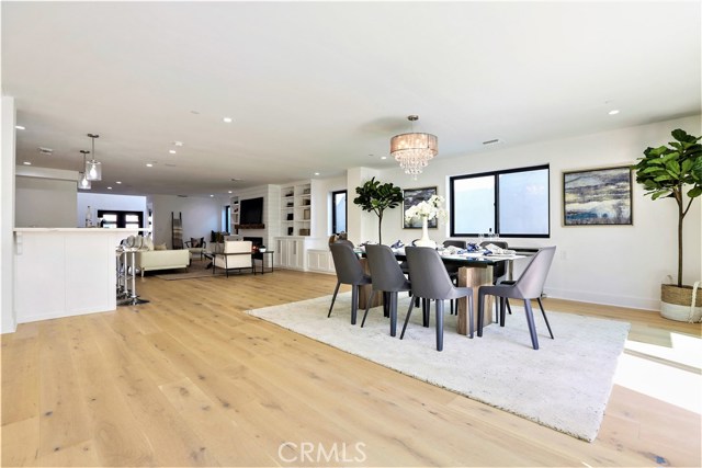The Spacious Dining Room Area is adjacent to the Living Room, Bar and Kitchen.