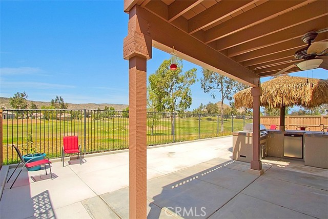 Entertain friends and family with this awesome outdoor kitchen.   BBQ w refrigerate, sink, eat at bar and thatch  umbrella roof, enjoy the view, cook some food while kids swim in the pool