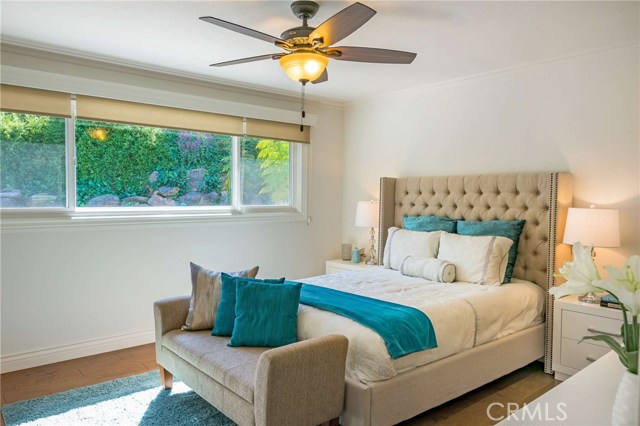 Elegant master with full wall of closets and en-suite bath.