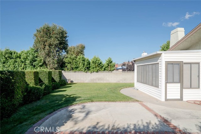 Maybe removing the patio room would be an improvement.  This could be a spectacular yard! 
50' wide.