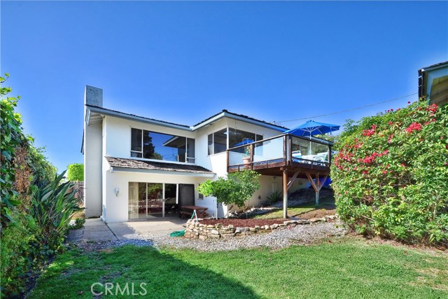 Rear of house with patio and deck