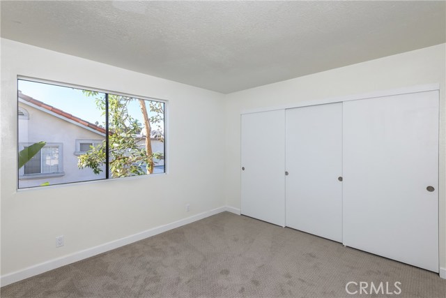 Rear Bedroom with a Wall of Wardrobe Closets!