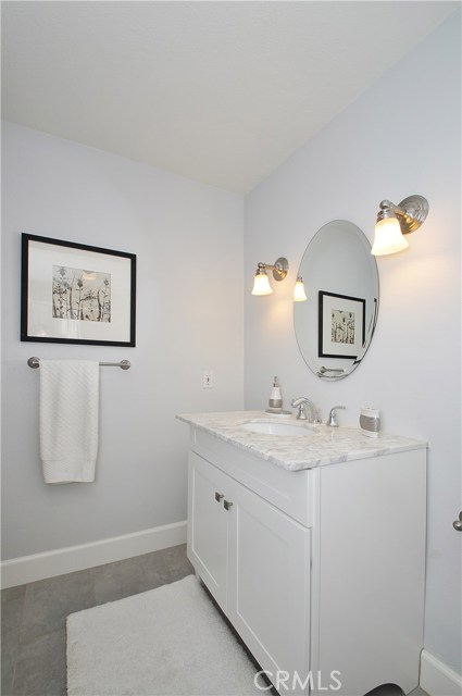 Hall bathroom - Grey stone,  Pale Grey and White Quartz Counters