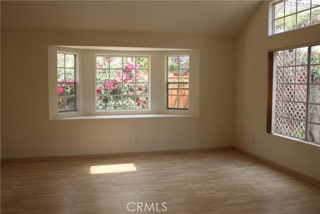 Living room looking out to patio.  The light square on the floor is a reflection of the skylight.