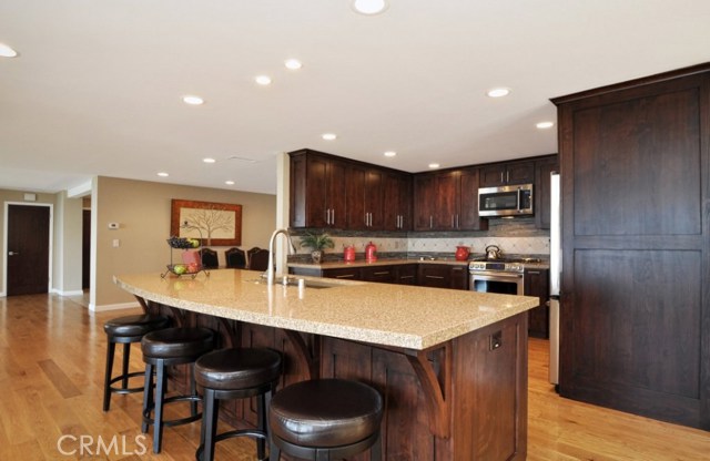 View of the kitchen from the island with quartz countertop.