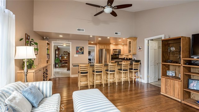 Family room view into kitchen.  Laundry room and half bath to right.