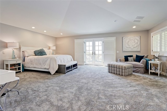 A true delight, the Master Bedroom is warm and romantic, adorned with a gorgeous marble fireplace, a private ocean view balcony, and a deep, walk-in closet.

