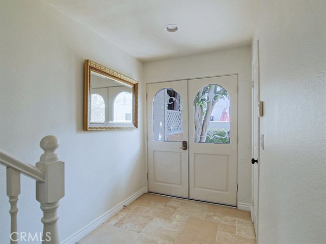 Travertine floors in front door entry