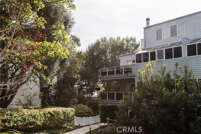 #210 is on the second floor, with an oversized wrap-around balcony and ocean peek.