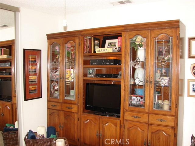 WALL NEXT TO CLOSET OFFERS ROOM FOR A MEDIA CENTER.