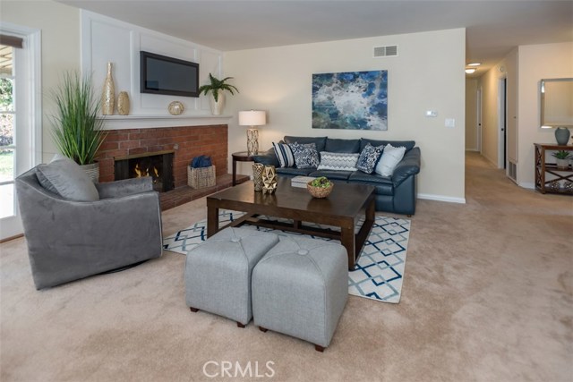 Living room with wood burning fireplace