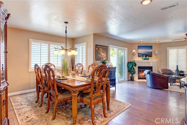 Large dining room area capable of seating 8-10 people or more, adjacent to living room.  Plantation shutters throughout!