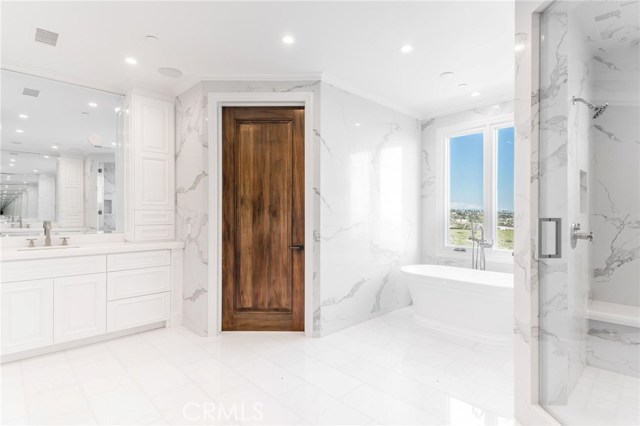 Duel sink and vanity areas on either side of the master suite bathroom