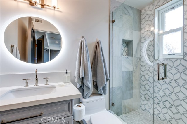 This 3/4 bathroom is connected to the guest suite