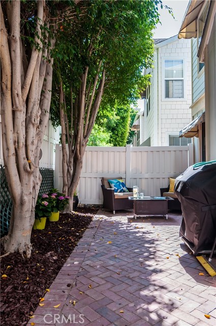 The backyard includes a private brick patio.