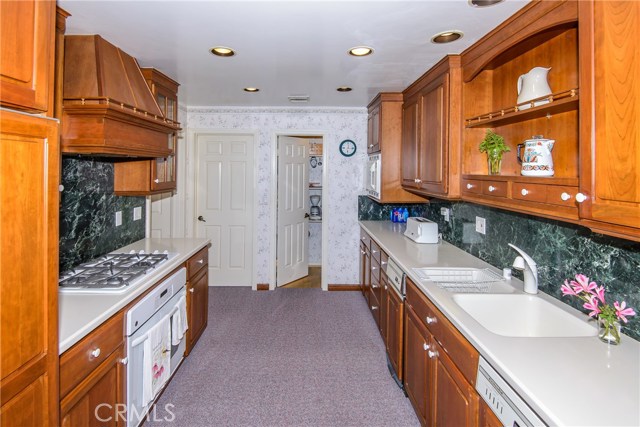 Gas cook top with hood vent and don't miss the walk-in pantry!