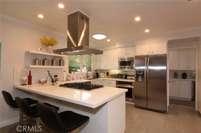 Fabulous kitchen has quartz counters, subway tile backsplash, and nice LG stainless appliances.  So pretty!