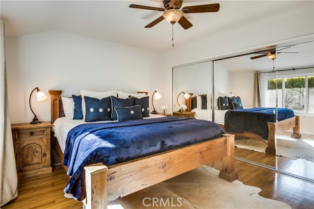 Master bedroom with large mirrored closet