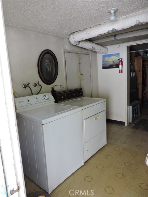 Shared laundry room.  Both water heaters are located here as well.