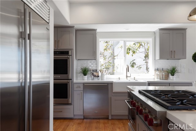 Kitchen with Cove Dishwasher, Sub Zero Refrigerator, Wolf Range top