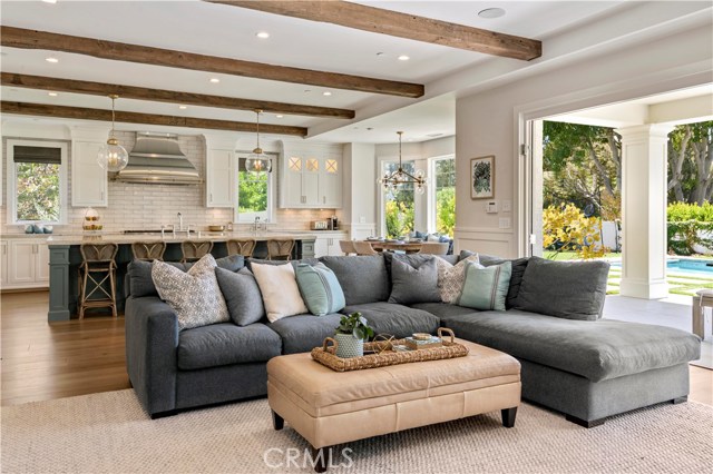 Spacious living room with stunning beamed ceilings that is wired for sound