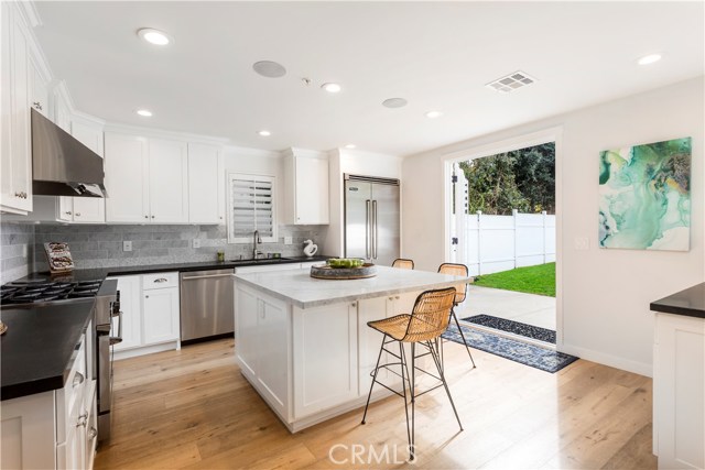 KITCHEN OPENS TO GREEN BACKYARD