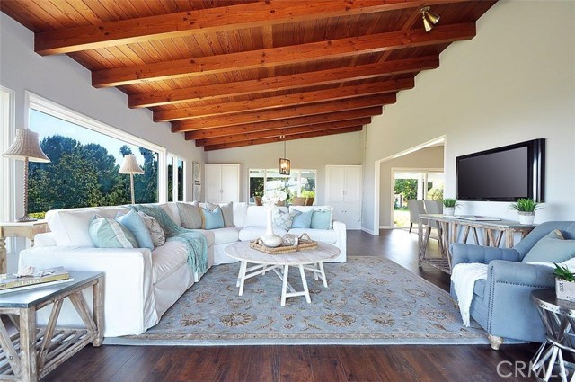 Large family room with beamed ceilings and gorgeous view.