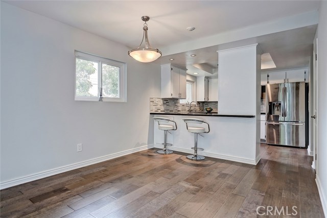 Large eat-in countertop and dining area.