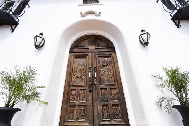 Powerful wooden front doors greet you as you enter.