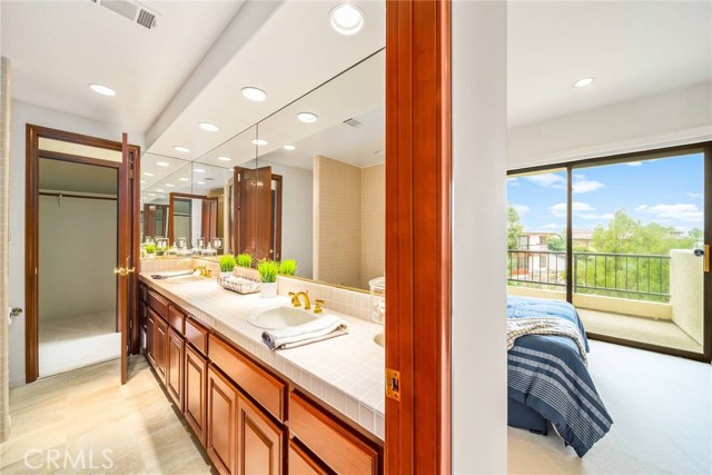 Bedrooms separated by Jack and Jill bath with tub and separate shower