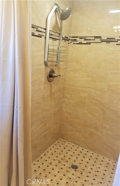 Downstairs bathroom with custom tiled shower