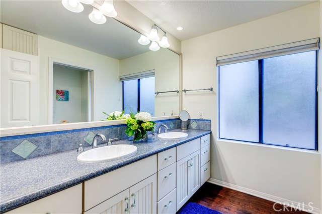 This full bath with double sinks services 2 of the 4 bedrooms on this level